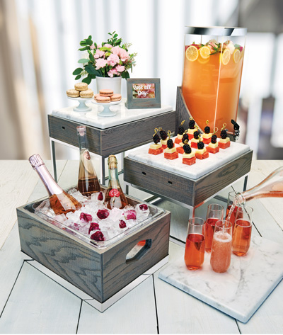 Assorment of fresh beverages on gray modern ice holders.