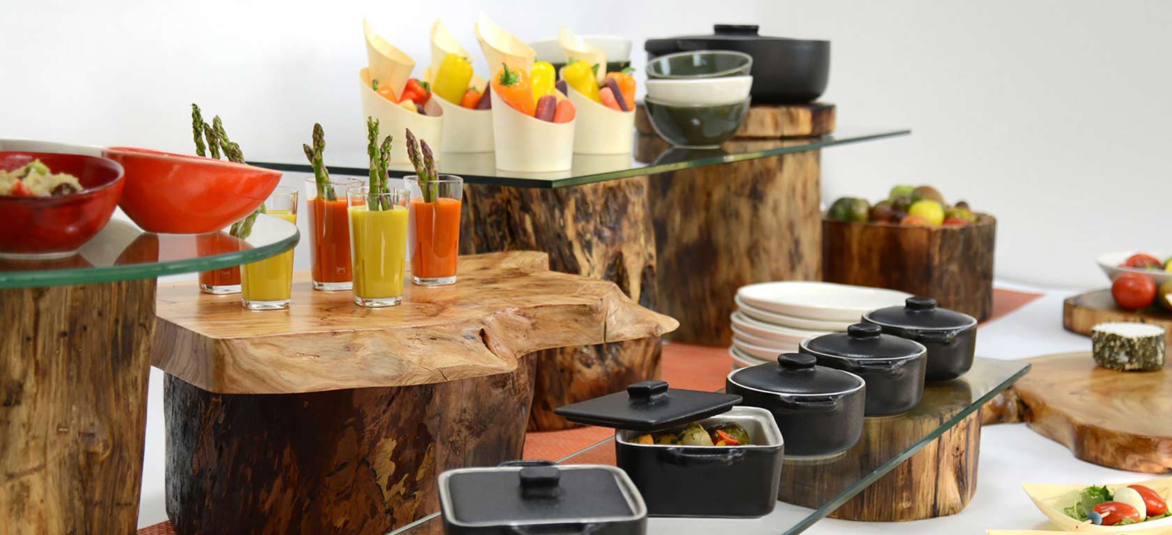 Food assortment arranged on pieces of logs.